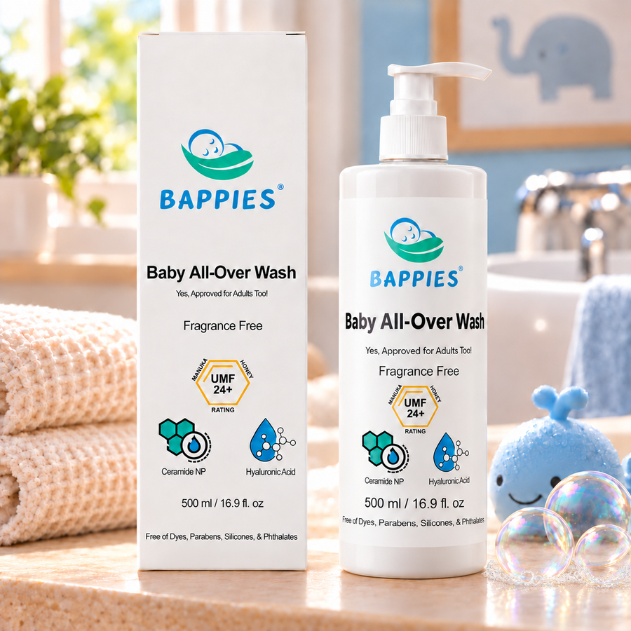 Bappies Baby All-Over Wash bottle and box with bubbles beside a blue whale bath toy